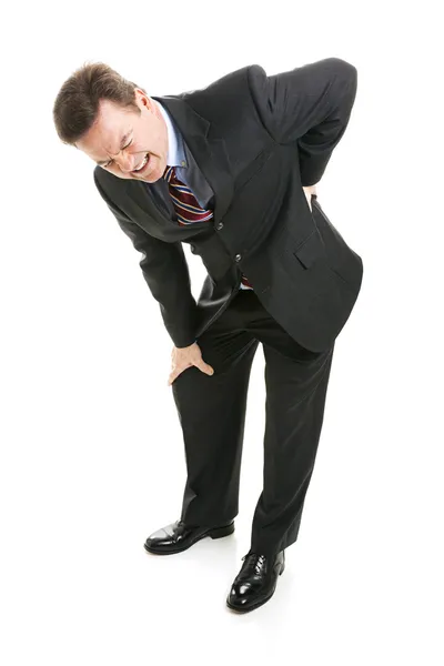 Uomo d'affari soffre di mal di schiena — Foto Stock