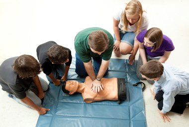 Group of Teens Take CPR Class clipart