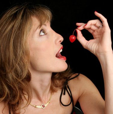 Beautiful Woman Holding Cherry clipart