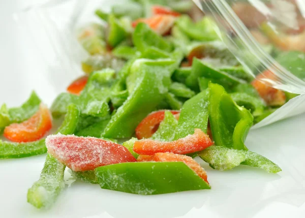 Pimentos doces vermelhos e verdes congelados — Fotografia de Stock