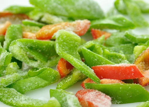 Frozen red and green sweet peppers — Stock Photo, Image