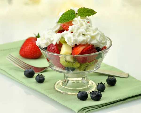 Fruit salad with cream — Stock Photo, Image