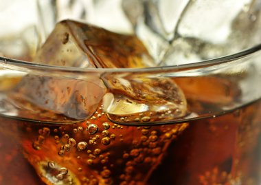 Cola with ice cubes close up clipart