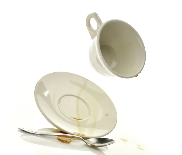 stock image Cup and saucer with spilled coffee