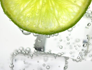 Iced drink with lemon , close up clipart