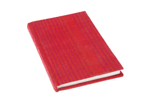 Libro de tela cubierta roja aislada sobre fondo blanco — Foto de Stock