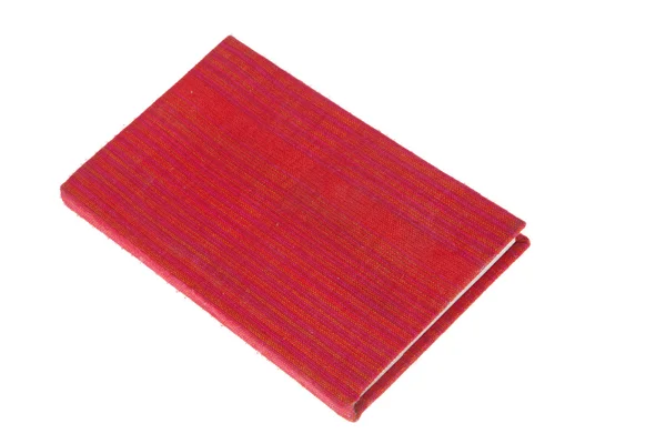 Книга красная ткань крышки изолированы на белом фоне — стоковое фото
