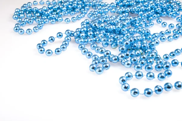 Shining blue beads on white — Stock Photo, Image