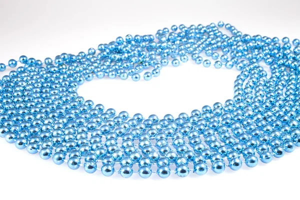 Shining blue beads on white — Stock Photo, Image