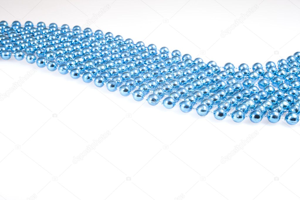 Shining blue beads on white