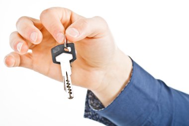 Businessman holding keys clipart