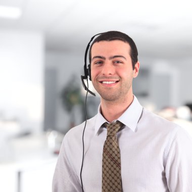 Young man wearing headset clipart