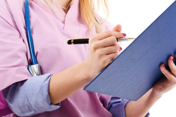 Nurse looking at a case history — Stock Photo, Image