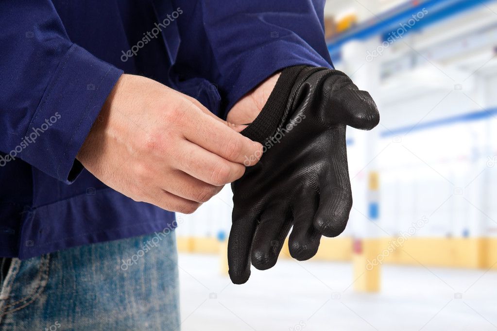 Mechanic putting safety gloves
