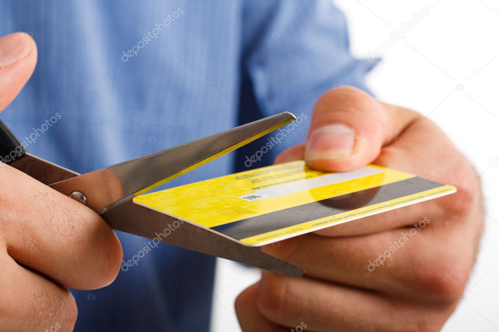 Scissors cutting a credit card