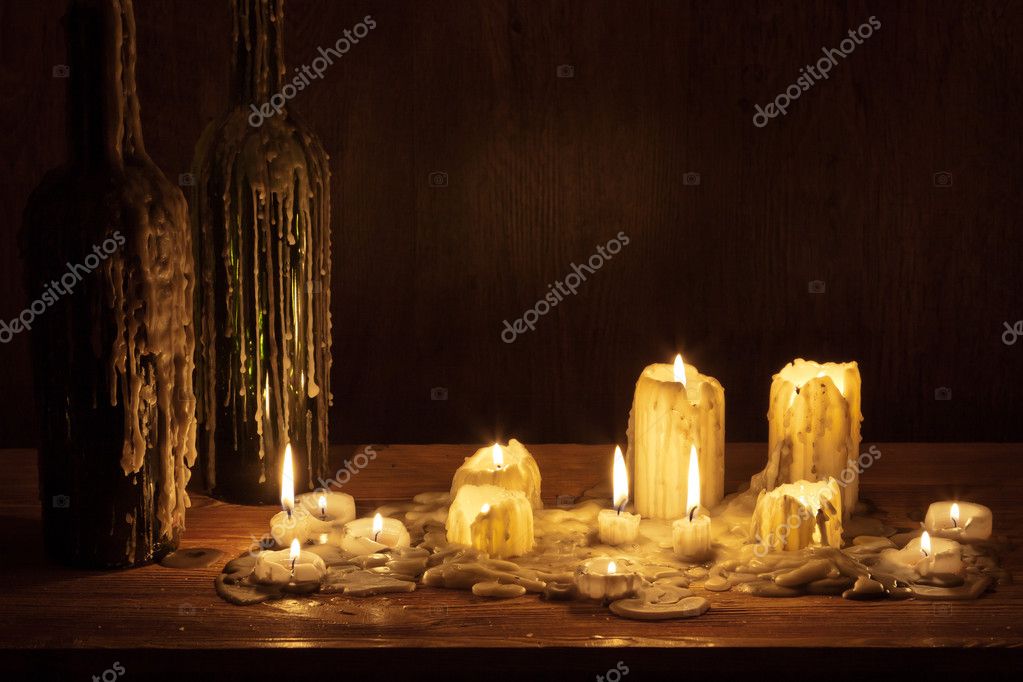 melting candles in bottles