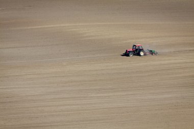 Tractor on dusty Field isolated clipart