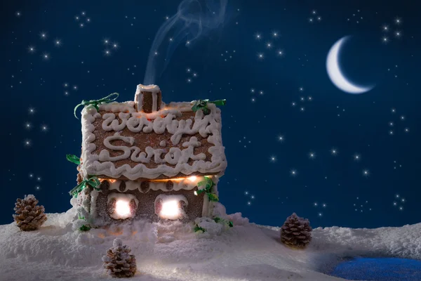 Smoke poured out of the gingerbread home at night — Stock Photo, Image
