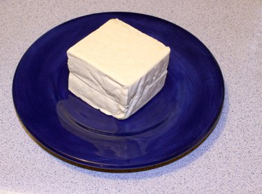 Tofu on a blue plate clipart