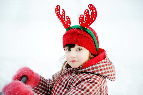 Winter portrait of adorable child girl in horned hat — Stock Photo, Image