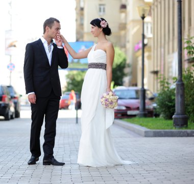 Groom kissing bride's hand clipart