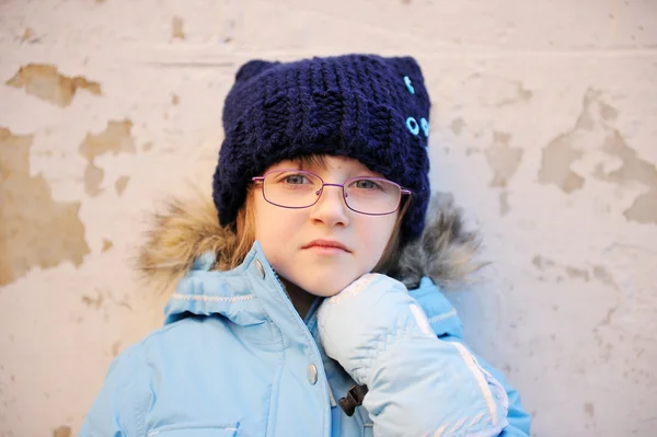 Portrait of sad child girl in warm winter clothes — Stock Photo, Image