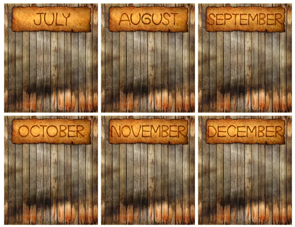 O mês em estilo vintage na madeira velha e envelhecida da parede — Fotografia de Stock