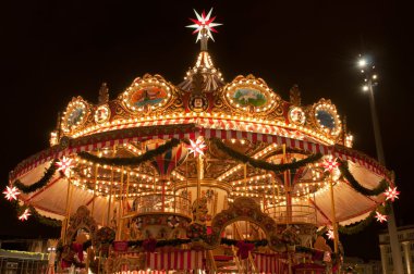 Children Merry-go-round at Christmas Market in Dresden clipart