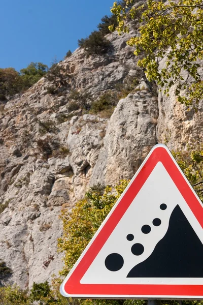 stock image Road sign falling stones