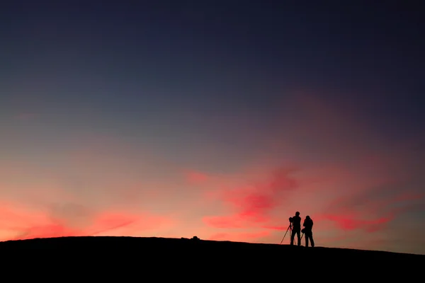 stock image Couple photographers shooting in desert