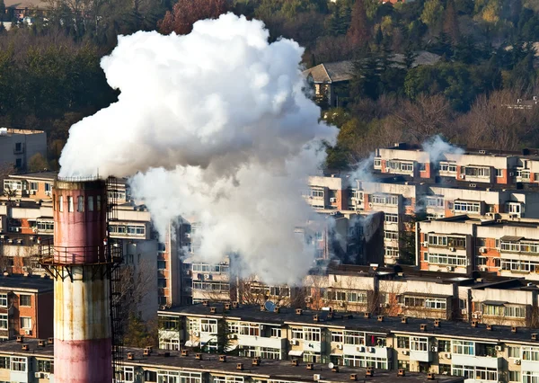 Smoke and air pollution in residental block — Stok fotoğraf