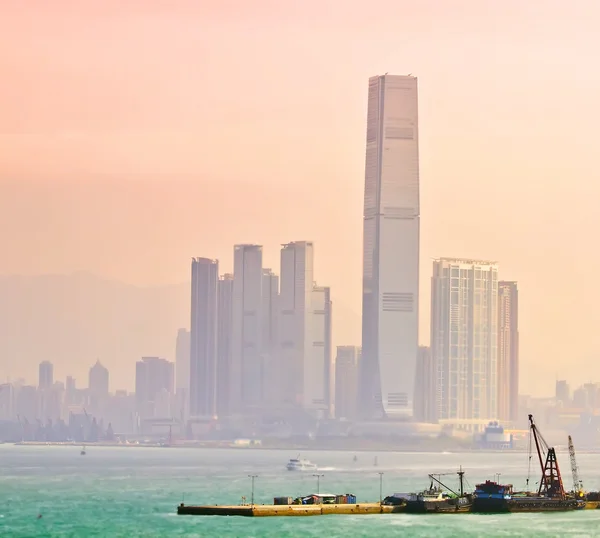 stock image Industrial harbor in front of Hongkong city buildings in fog