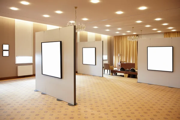 Blank white frames in art gallery interior — Stock Photo, Image