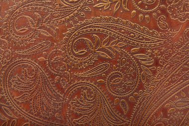 Floral pattern in brown leather