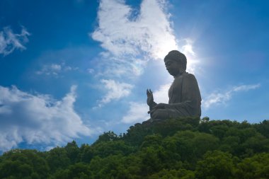 Giant Buddha sitting on hill, Hong Kong, china clipart