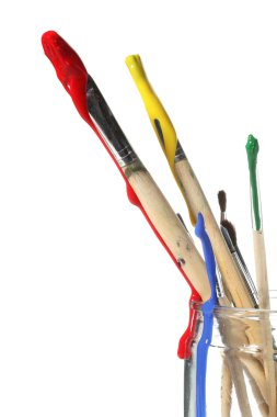 Paint brushes covered in paint clipart