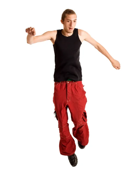 Young man jumping. Studio shot over white. — Stock Photo, Image