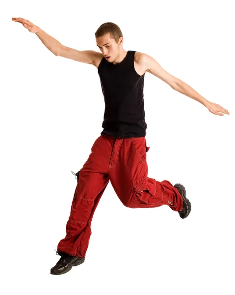 Junger Mann springt. Studioaufnahme über Weiß. Stockbild