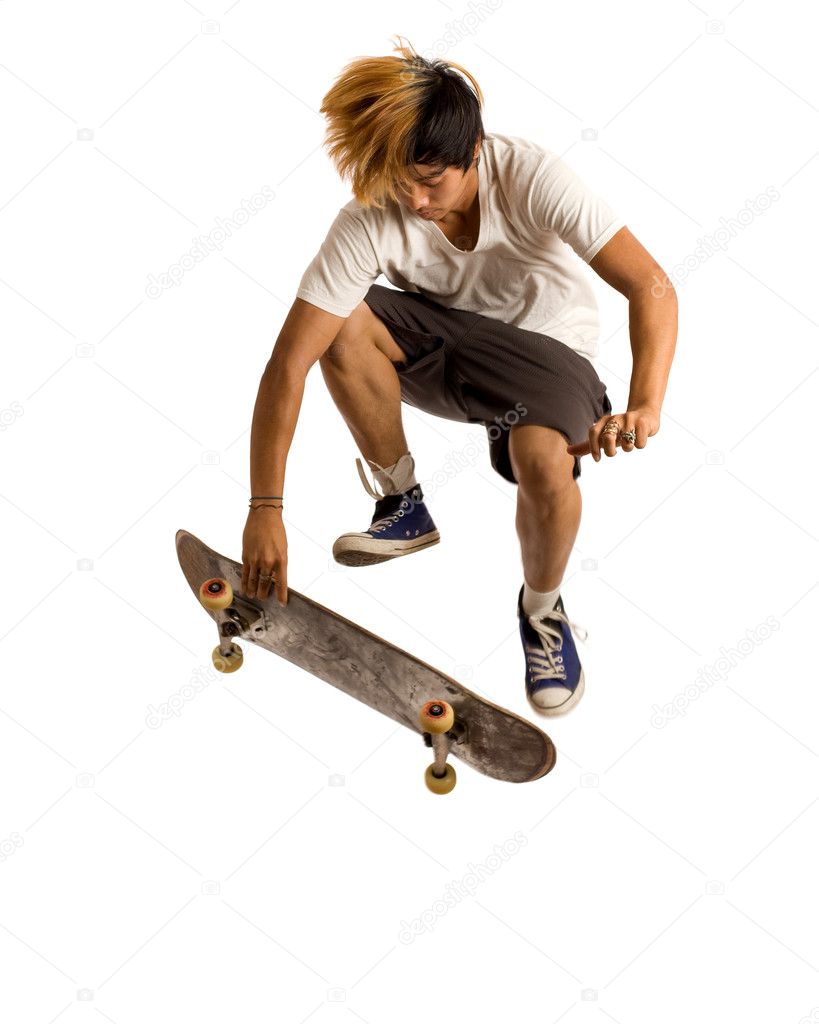 Young man skateboarding. Studio shot over white.