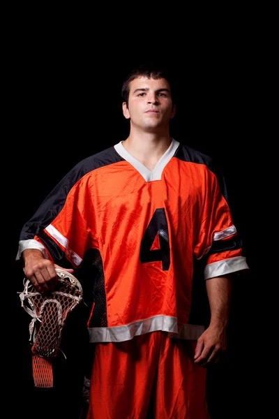 Jogador de lacrosse masculino. Estúdio tiro sobre preto . — Fotografia de Stock