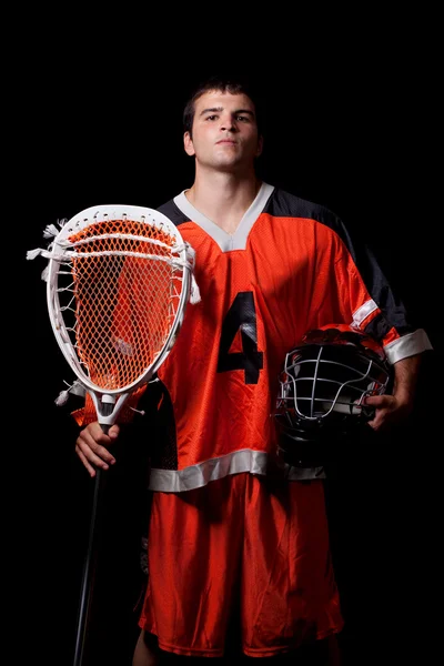 Male lacrosse player. Studio shot over black. — Stock Photo, Image