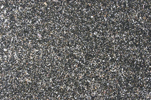 Чорний пісок як фон — стокове фото