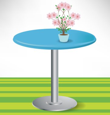 simple round unoccupied table with flower decoration clipart