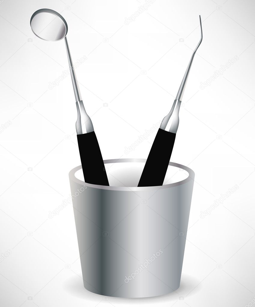 dental instruments in cup isolated
