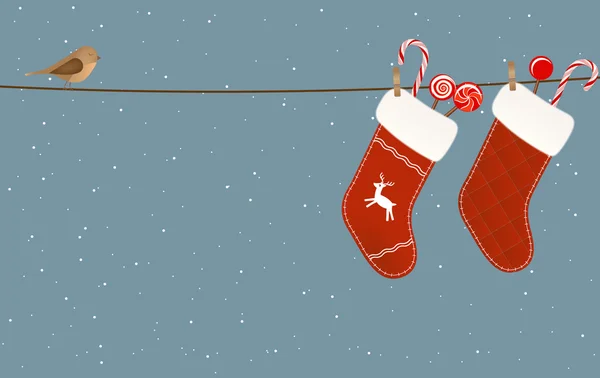 Різдвяні шкарпетки висять на лінії одягу — стоковий вектор