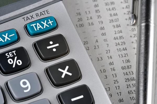 TAX - Calculadora, caneta e alguns números — Fotografia de Stock