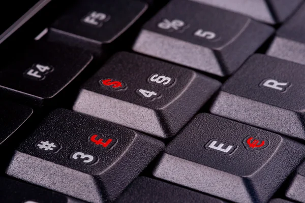 Tastatur mit Währungssymbolen in rot — Stockfoto