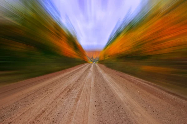 Autumn colors country dirt road zooming effect — Stock Photo, Image