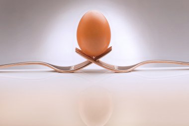 Egg with a fork clipart