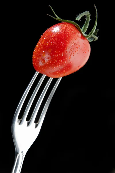 Cherry tomato on fork — Stock Photo, Image
